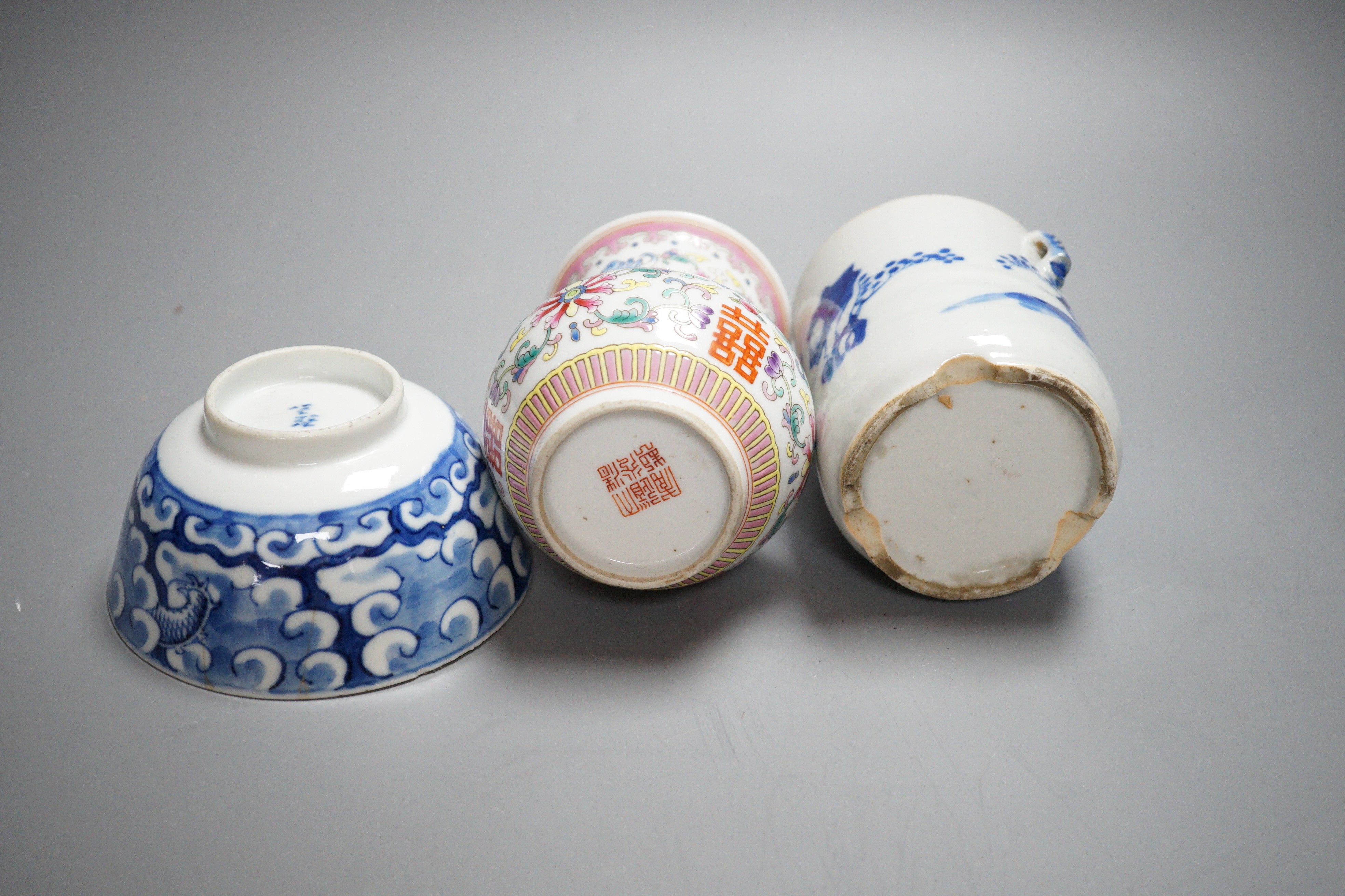 An early 20th century Chinese famille rose vase, a Chinese blue and white jar, lacking cover and a blue and white bowl